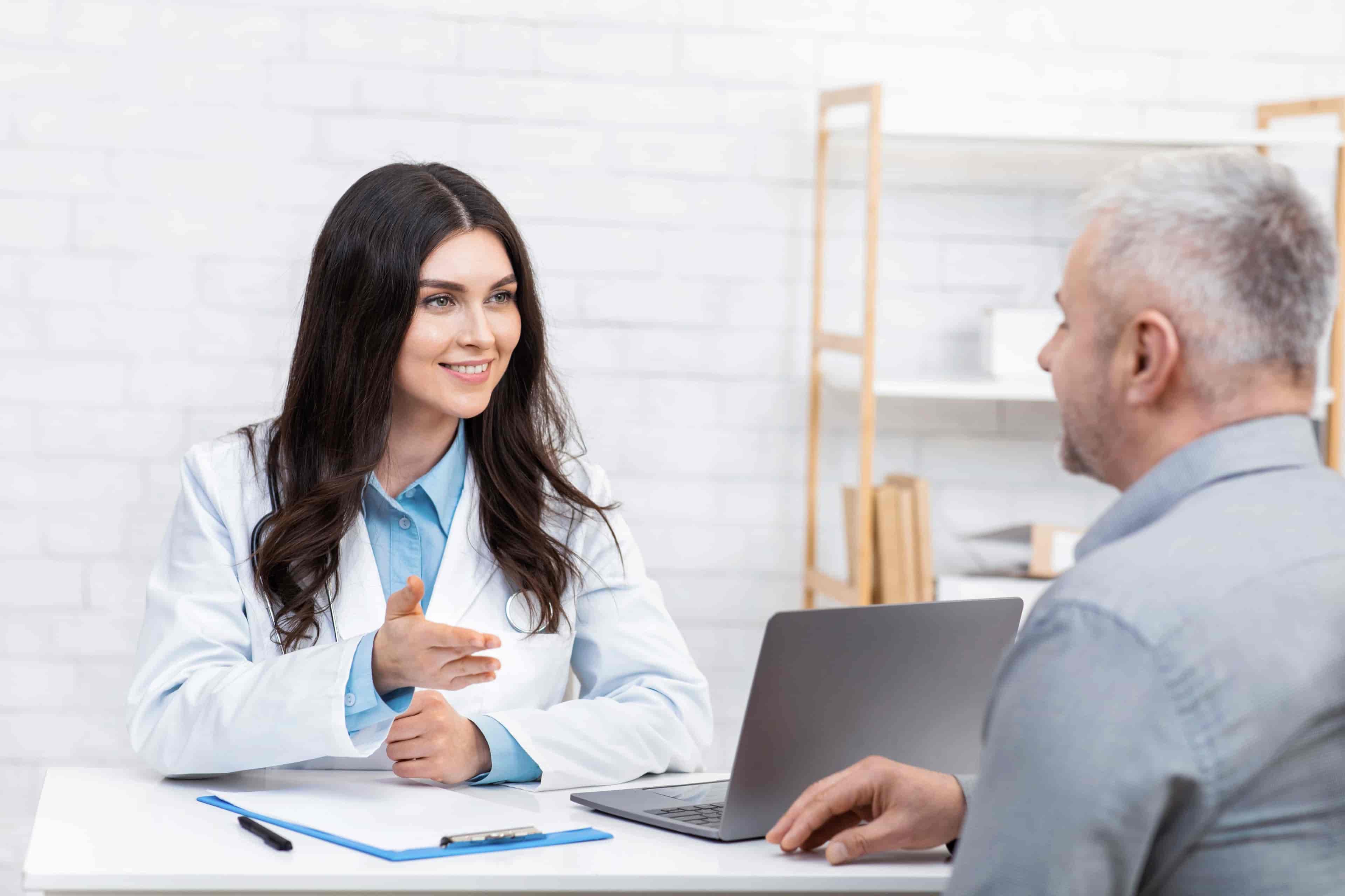 Experienced doctor smiling in a clinic, ready to provide healthcare services